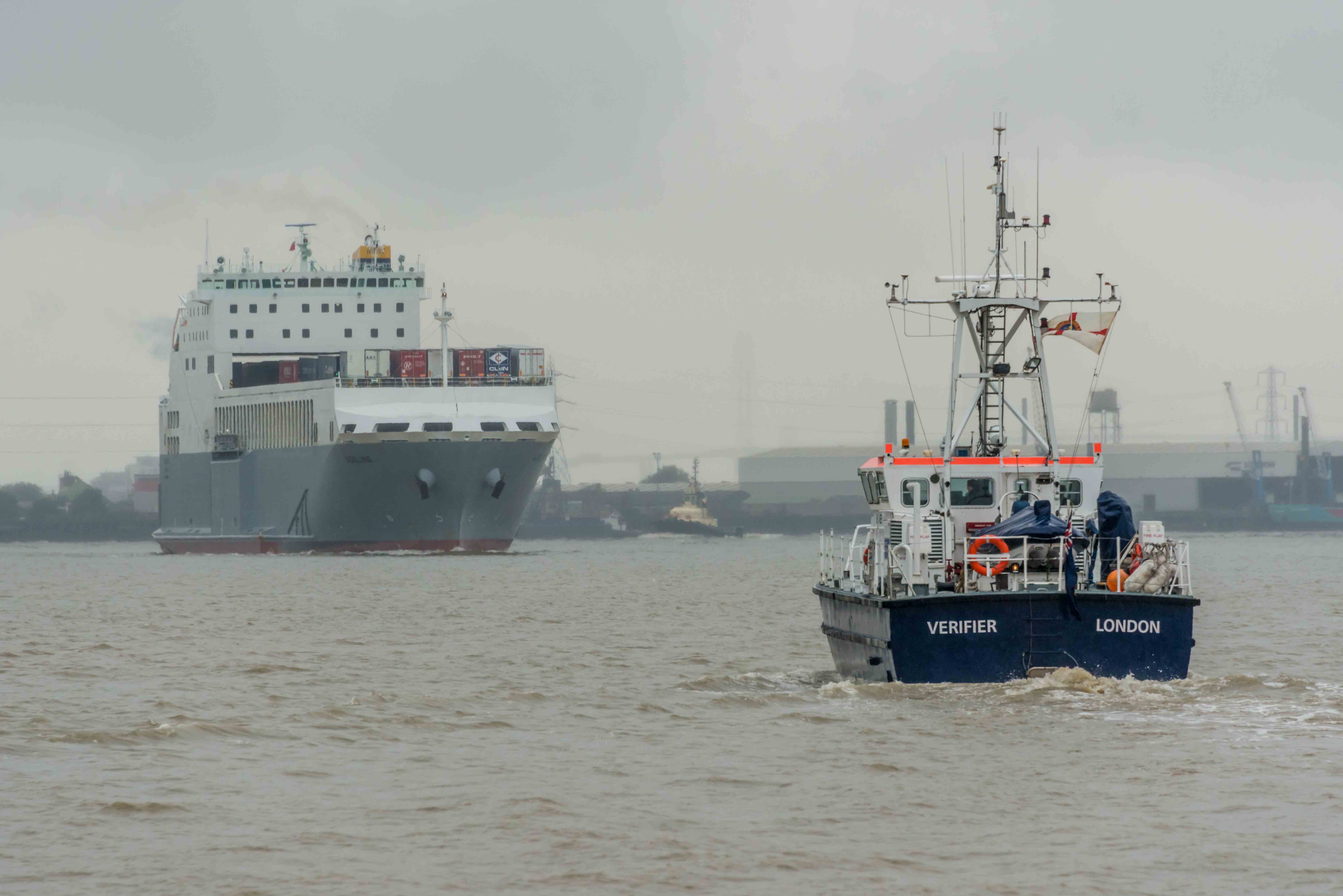 Photograph of two ships, one is PLA survey vessel VERIFIER